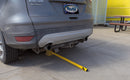 Collapsed Yellow Bollard under SUV