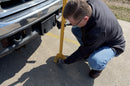 Man unlocking folding bollard
