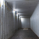 String lights illuminating shipping container.