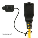 Weatherproof cover tethered to a black and yellow power cord.