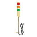 Three-color industrial indicator light with a cable on a white background.