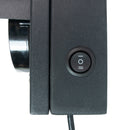 Close-up of a black traffic light with a power switch on a white background.