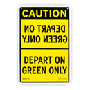 Yellow and black sign with mirrored text on top half stating, "DEPART ON GREEN ONLY."
